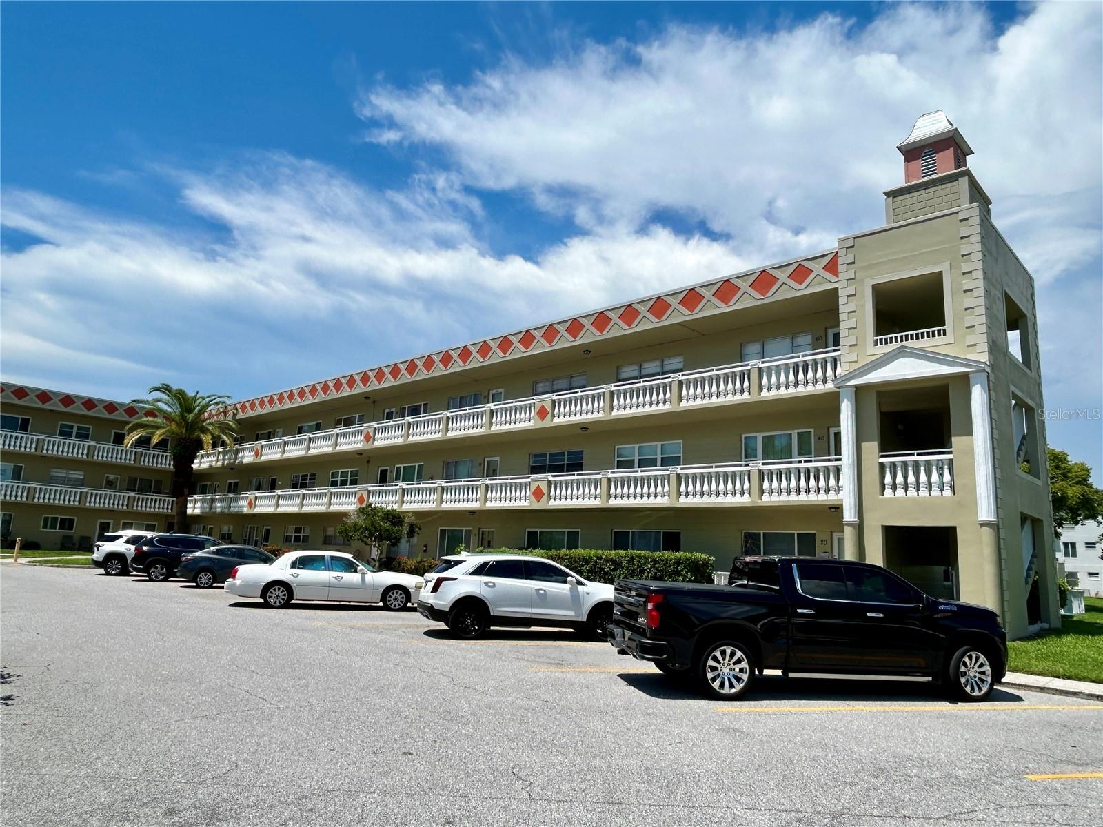 Welcome to this fully furnished, 2 bed, 2 bath oasis. The unit is on the third floor, so no footsteps from above! The updated kitchen features decorative raised panel cabinets and stone counters with a ceramic tile backsplash, and newer appliances. Luxury vinyl plank flooring extends from the kitchen into the light and bright Florida Room. The large Primary Bedroom includes a private ensuite bathroom tastefully updated with ceramic tile flooring, shower doors and vanity top, offering a blend of style and functionality. The AC was replaced in 2009 and there are ceiling fans in the bedrooms and Florida Room to help keep you cool. The water heater was replaced in 2018. Located in a vibrant 55+ community, you'll have access to a wide range of amenities designed to enhance your lifestyle. Enjoy two private golf courses (9 and 18 holes), two heated swimming pools, and two activity centers. Stay active in the remodeled cardio gym or engage in various community activities like fitness classes, dancing, clubs, cards, and billiards. Pet owners will love the pet-friendly environment, featuring a fenced dog park and covered seating areas. Residents can also enjoy hobby studios and a woodshop for creative pursuits. The on-site Good Karma Café offers convenient 'take & bake' meals and snacks. Conveniently located near beaches, transportation, shopping, entertainment, and fine dining. Schedule your showing today and enjoy the best in comfort and convenient living!