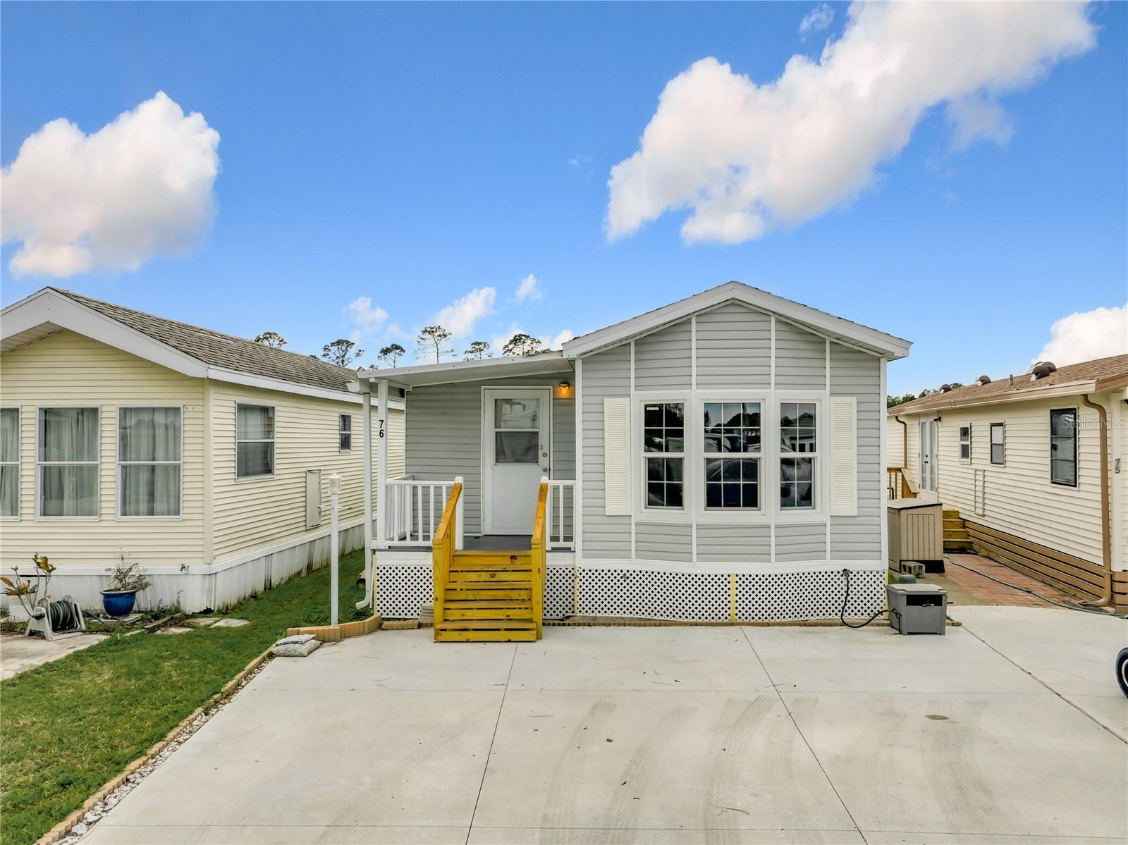 LAKE FRONT PROPERTY! - WELCOME TO THE KOVE ESTATE 55+ CO-OP Community Resort Style Living at its finest. RETIRE WITH CONFIDENCE and INVEST in your little piece of PARADISEa premier 55+ community in Osteen Fl.. There is no lot rent, as a share in the community conveys with the sale. The monthly cooperative fee (HOA) $219 Includes Water/Sewer/Trash. Enjoy Year Round 9 Hole Golf Corse, 2 pools, one heated, tennis courts, pickleball, community events and the peaceful nights all in your very own gated community. This charming 1996 oasis is high and dry. This unit features 1 bedroom, 2 FULL BATHROOMS with an Den/Extra private Sleeping space This home offers Newer Windows tons of natural light. Family Room with an Updated Kitchen combination that offers a cozy and comfortable living space. Recently Releveled, Newer Subfloors and Flooring, Updated bathrooms, Newly Expanded Driveway/Parking, New Skirting, Updated Electrical, Newly plastered and painted interior. Conveniently located off SR415, minutes to Sanford, Deltona, New Smyrna Beach. Call TODAY to View. 55+ Community CASH ONLY CO-OP Community. HOA includes, Water, Sewer and Trash Pickup NEWER ROOF IN 2018, NEWER REFRIGERATOR 2022, NEWER HVAC SYSTEM, 8'X6' SHED INSTALLED 1998 - SHED HAS WASHER USE WITH COLD WATER ONLY. (MEASUREMENTS AND INFO IS NOT WARRANTED, BUYER AND/OR BUYER'S AGENT TO VERIFY)