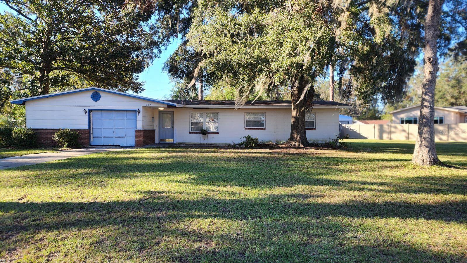 Charming Opportunity in Lake City! This 3-bedroom, 1-bath home offers 1,142 sq ft of living space on a 0.28-acre lot, featuring a new roof and updated electrical panel. Recently painted inside and out, this property includes an attached garage/workshop, providing both functionality and storage space. The gas line is capped, offering future potential if desired. The interior is ready for cosmetic rehab, making this home an excellent investment for those looking to add their own touch.