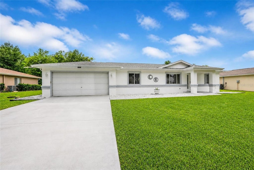 Photo of 10452 SW 62nd Terrace Road, Ocala, FL 34476 (MLS # OM734773)