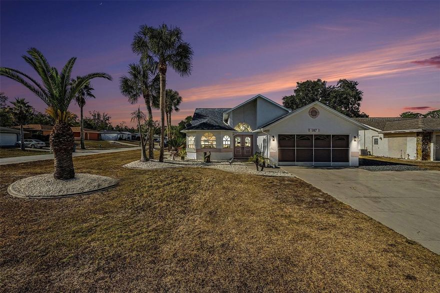 Step inside and you’re greeted by a bright front foyer with tall ceilings and eye-catching custom stained-glass details that instantly set the tone. From there, the layout opens into a spacious living and dining area with an easy, open flow, LVP throughout the main living spaces, and ceiling fans in every room. The electric fireplace adds a cozy focal point for movie nights and laid-back evenings at home. To the left of the home, the kitchen is set up for real life: plenty of cabinet space, an island for prep, and a sunny breakfast nook. The living and dining combo leads you into the den/flex space, complete with a Murphy bed, so it can work as an office, hobby room, or guest space when you need it. From there, step into the patio with windows, a great bonus space to enjoy the outdoors. The split bedroom plan keeps the primary suite separate from the other two bedrooms and the second bath. The main bedroom is spacious, and the en suite bath includes a jet tub plus a stand-up shower. You’ll also appreciate the practical touches like the large storage closet and the 2-car garage with the washer and dryer. Outside, the corner lot gives you extra breathing room, plus a shed for storage. The community has a very low HOA of $24, no CDD, and no flood insurance required. The Community Center offers a horseshoe area, shuffleboard courts, picnic tables, BBQ grills, and a library. When you’re ready to get out and enjoy the area, you’re close to some of the best “Florida” experiences around, including the world-famous Weeki Wachee mermaid shows and park attractions, which are located 5 minutes away. Want a beach day without the long haul? Pine Island Park is a Gulf-front Hernando County park with a beach and swimming area only 10 min away, and Rogers Park is a local favorite on the Weeki Wachee River for swimming and paddling. For everyday convenience, Publix and Walmart Supercenter are right on Commercial Way. And for dining, you’ll find plenty of options nearby. Come see this gem in person, schedule your private tour today!