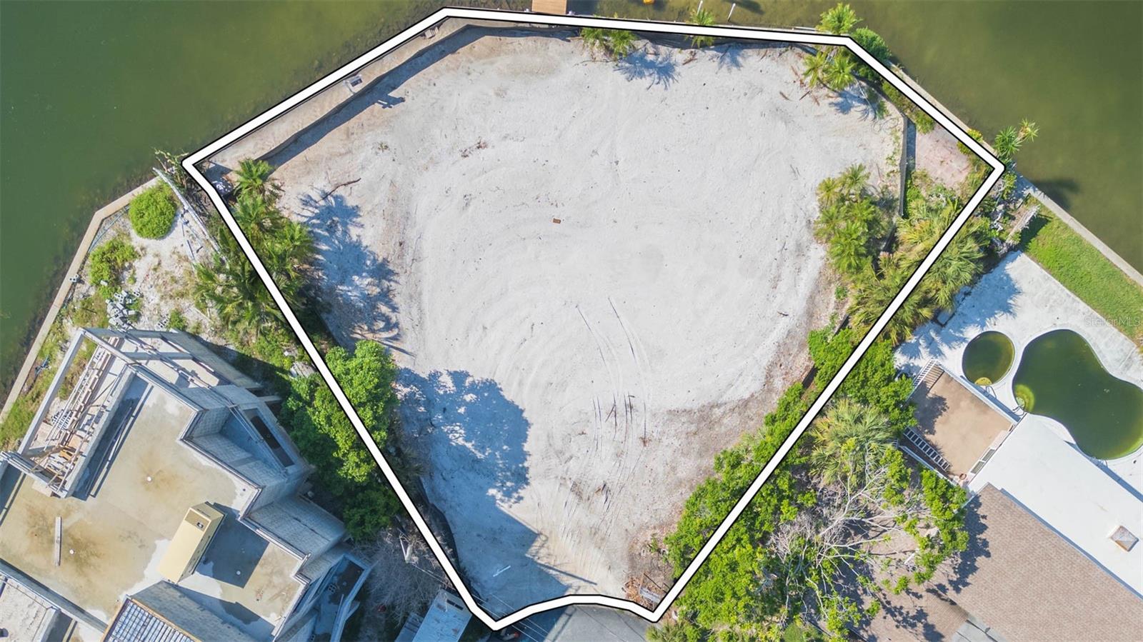 Reduced to Sell! Seize this rare opportunity to own a prime waterfront property in the highly desirable St. Pete Beach community. This 10,441 sq. ft. lot boasts over 165 feet of open water frontage, offering breathtaking views that are unmatched in the area. Featuring a newer seawall and a deep water dock, this property is perfect for those who dream of coastal living with direct water access. It presents the perfect blank canvas for a new homeowner to design and build a personalized masterpiece from the ground up. Just steps away from pristine beaches, exceptional dining, and year-round vacation vibes, this property is truly a slice of paradise with immense value and potential.