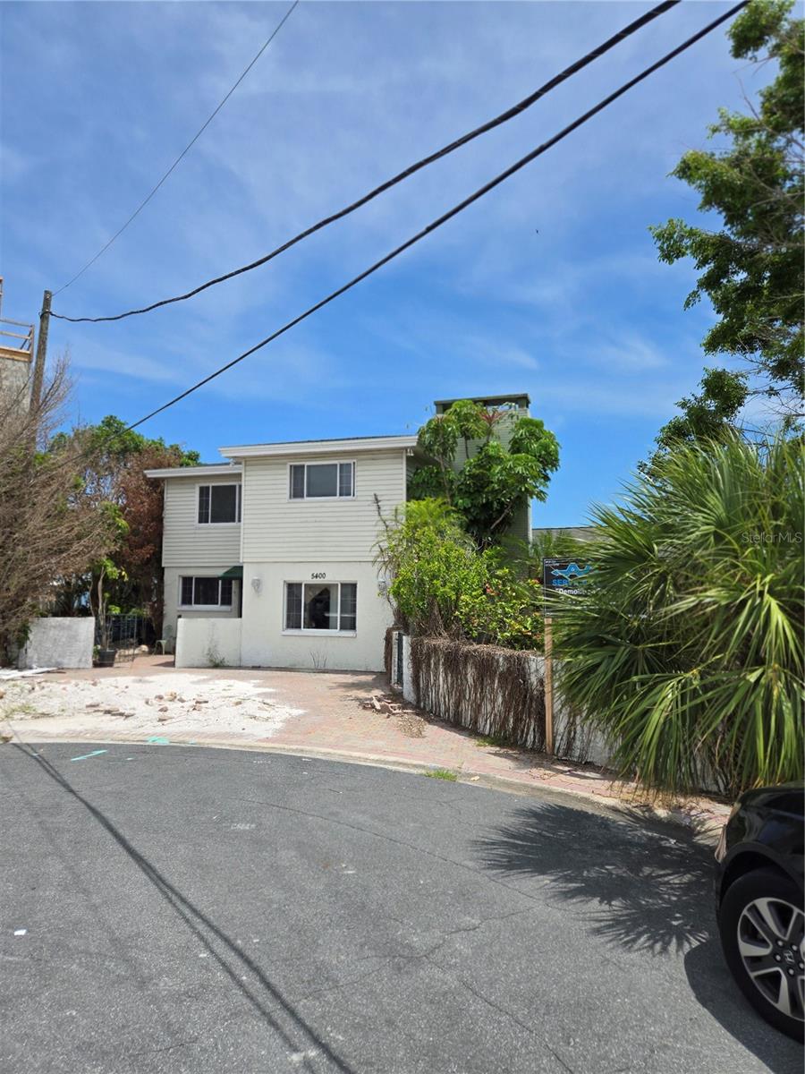 Seize this rare opportunity to own a prime waterfront property in the highly desirable St. Pete Beach community. This 10,441 sq. ft. lot boasts over 165 feet of open water frontage, offering breathtaking views that are unmatched in the area. Featuring a newer seawall and a deep water dock, this property is perfect for those who dream of coastal living with direct water access. Sold as-is post-storms, it presents the perfect blank canvas for a new homeowner to design and build a personalized masterpiece from the ground up. Just steps away from pristine beaches, exceptional dining, and year-round vacation vibes, this property is truly a slice of paradise with immense value and potential.
