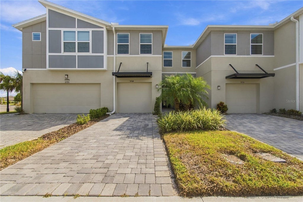 Photo of 31564 Woodland Race Loop, Wesley Chapel, FL 33545 (MLS # TB8553277)