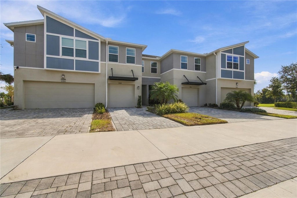 Photo of 31564 Woodland Race Loop, Wesley Chapel, FL 33545 (MLS # TB8553277)