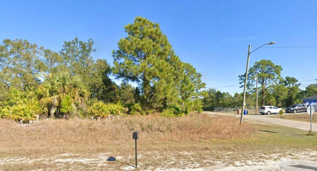 Photo of 885 Milwaukee Boulevard, Lehigh Acres, FL 33974 (MLS # O6401626)