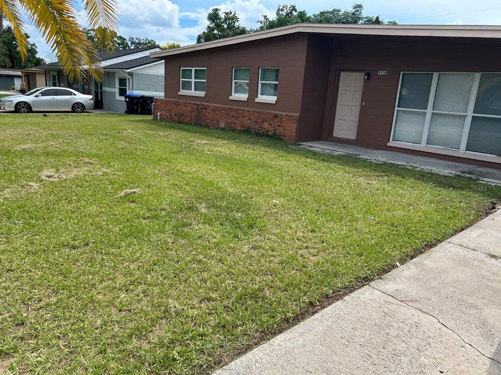 Photo of 5930 Forest Grove Boulevard, Orlando, FL 32808 (MLS # S5157122)