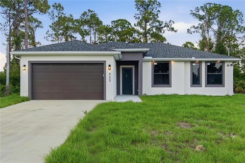 Photo of 923 Milwaukee Boulevard, Lehigh Acres, FL 33974 (MLS # TB8512402)