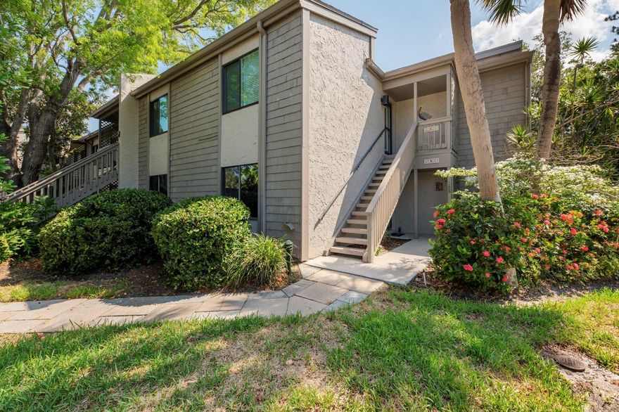 This ground floor condominium is a three bedroom plus a DEN with stunning views of Pelican cove harbor and is nestled under a canopy of oak trees with storybook views on a point surrounded by the harbor.  The open floor plan with the sunny & bright Florida lanai room boasts loads of storage in and out.  This condo is centrally located within Pelican Cove, one of Sarasota's most popular gated, waterfront complexes. It's a short walk from the front door to the most picturesque of the six heated pools, or to the serene deck at Pelican Point to watch the sun set over the bay.  Pelican Cove is spread out over 75 acres of natural beauty, built along Sarasota Bay. Pelican Cove has to be seen to be appreciated with manicured tropical foliage, tennis courts, 6 pools, exercise room and workshops of all kinds. Activities of every type are present: Art, Music, Wood working, Boating, and Fitness & Pelican University, kayaking, fishing, 6 pools, 4 tennis courts, a private harbor and numerous clubs and activities. Additional storage has been added to this condo for new owners' convenience. Pelican Cove is spread over 75 acres and amenities include/gated community of botanical setting on Little Sarasota Bay, within a gated community that offers sailboat, canoe, kayaking & fishing 6 pools, 4 tennis courts, a private harbor and numerous clubs and activities.