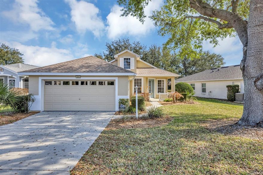 One or more photo(s) has been virtually staged. Welcome home to this fabulous 2 Bed/2 Bath home with deep lot, and would be a perfect home for Year-Round Living, or your Winter Retreat! Recent updates include NEW HVAC- WATER HEATER- KITCHEN LPV 2025, WASHER & DRYER 2024, NEW ROOF 2023, and newer microwave, dishwasher & gas range! Sweet Front Porch welcomes your friends & family to open plan living with volume ceilings and plenty of windows to make this home feel sunny & bright. The Kitchen features plant/display shelves, a large 4 door pantry, soaring 20' ceiling, plus a cozy Breakfast Nook for your morning cup of fresh squeezed orange juice! Both Dining Room and Great Room feature wood laminate flooring and access to the screened Lanai where you can relax and laze away the afternoons. The Great Room also includes a built-in entertainment center for plenty of TV/Movie time. The Guest Bedroom offers a large closet and is next door to the Guest Bath featuring a tub/shower combo, tile floor, and Corian countertop. Comfortable Primary Bedroom includes a spacious walk-in closet, ensuite Bath with step-in tiled shower and Corian countertop. The 2-car Garage includes door opener, attic access and handy storage cabinets.  “Royal Harbor” on the shores of The Harris Chain of Lakes is a fabulous "55+/Active Adult community" which includes RV & boat storage, cable TV, gated entrance, clubhouse amenities (heated pool & spa), grilling area poolside, day dock & fishing pier, walking trails, lighthouse recreation area, pickle ball/tennis, bocci, shuffleboard, numerous clubs & scheduled activities, and great neighbors too! Call today for your private showing and tour, you’re going to love it here!