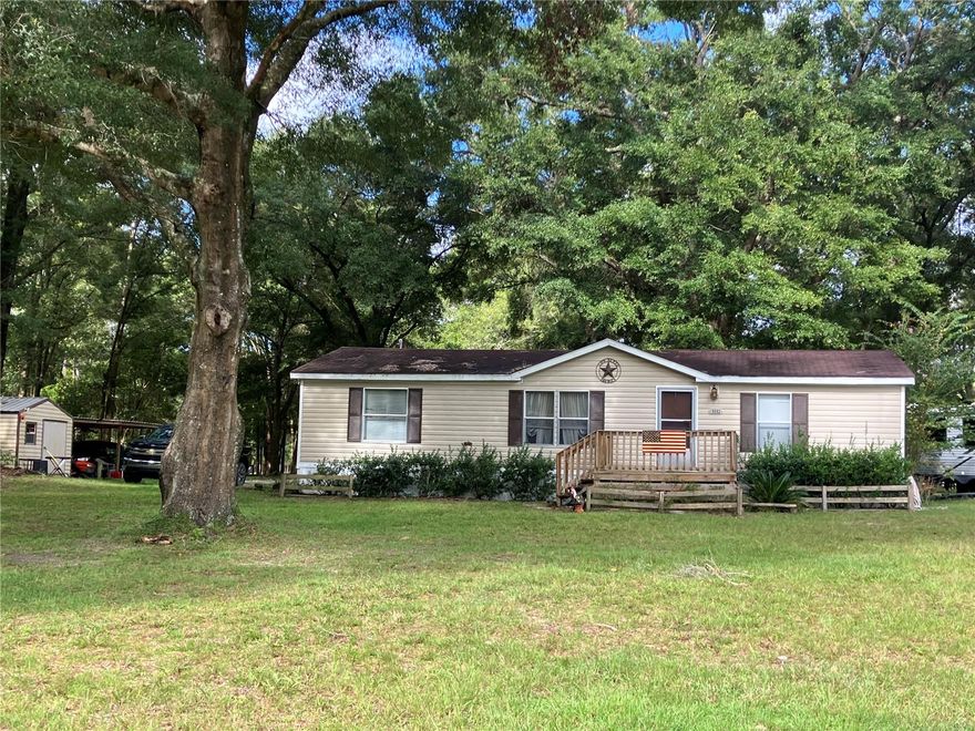 Location Supreme! Brand new Roof, Ac within 5 years old! Just minutes from downtown High Springs and quick access to I-75. This partially wooded and partially cleared 5 acre lot offers privacy and a beautiful park like feel all in one. No HOA and No Deed Restrictions! This home has a split bedroom plan with a large main bathroom. Open floor plan and large covered back porch with french doors, for the afternoon barbecues and family gatherings. This home has an ample size living and dining open floor plan. Spacious main bedroom  with barn style doors on closet and bath which gives you a cozy country feel. Large main bath with walk in shower, split floor plan for privacy of owners suite. This quiet neighborhood with large lots offers privacy and serenity for a peaceful retreat. You are just 10 to 15 minutes from the springs and the Santa Fe River for year round recreation. Schedule a showing today so we can get you in your new home!