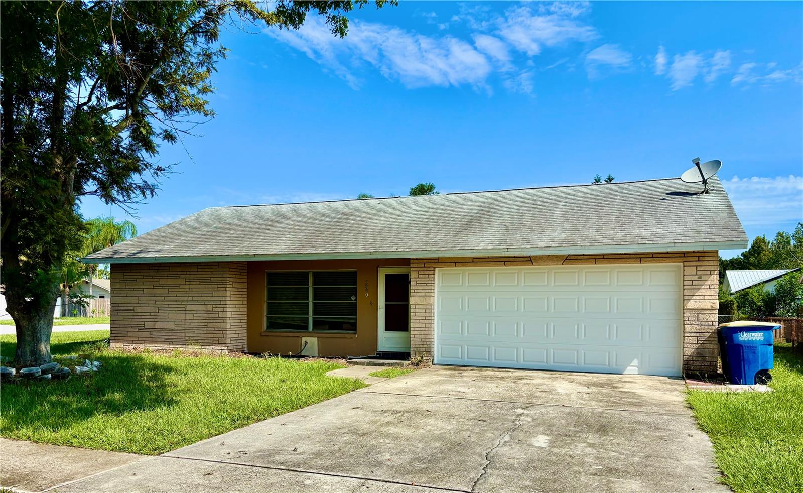 Solid home built in 1973 located in Clearwater, two miles from downtown Safety Harbor. Home has a split bedroom plan, is on a corner lot, indoor laundry, tile floors throughout, and a screened in porch providing an additional 180 square feet of shade. Home is dated and could use some TLC. AC was installed 5/15/2018, roof 7/22/2010 and new garage door 8/2025. Agent related to owner and is a signer for the LLC.