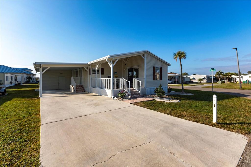 Photo of 27 N Manatee Loop, Punta Gorda, FL 33950 (MLS # C7520024)