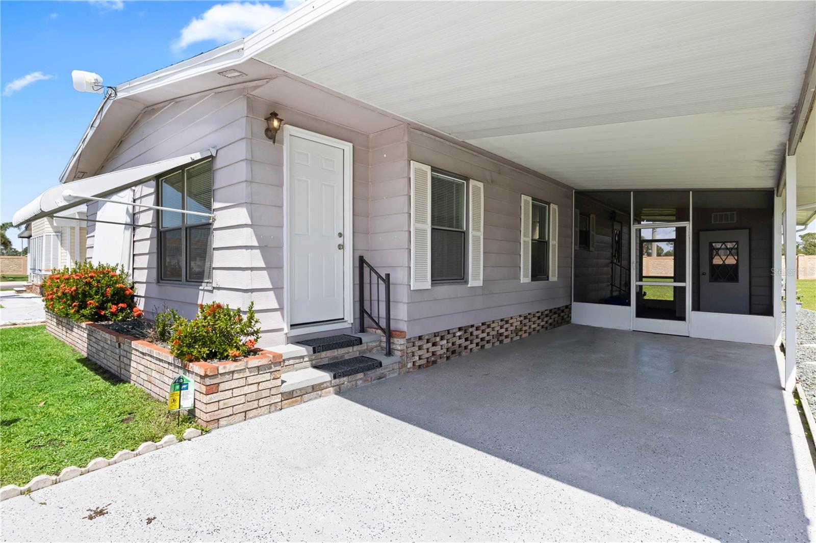 Beautifully maintained manufactured home located in the desirable 55+ gated community of Burnt Store Colony. This spacious two-bedroom, two-bath residence offers approximately 1,100 square feet of open-concept living space with vaulted ceilings, crown molding, and a split-bedroom layout that provides both comfort and privacy. The home features a bright, fully equipped kitchen with a skylight and breakfast bar, a large living and dining area ideal for entertaining, and inviting screened lanai perfect for enjoying Florida’s year-round sunshine. Thoughtful upgrades such as newer flooring, fresh interior paint, and an epoxy-coated driveway enhance both the style and function of the home. Burnt Store Colony offers resort-style amenities including a heated pool and spa, clubhouse, tennis and pickleball courts, shuffleboard, bocce, a dog park, library, and fitness center, all just steps from your front door. Ideally located near Burnt Store Marina, Charlotte Harbor, and the charming downtown area of Punta Gorda, this home provides the perfect blend of comfort, convenience, and active Florida living.