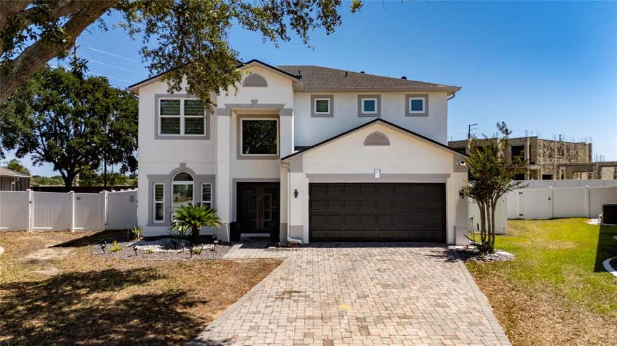 Beautiful 4-bedroom, 3-bath pool home situated on an oversized lot. This stunning home features tile flooring throughout the first floor and luxury vinyl flooring on the second floor. The kitchen and bathrooms have been completely renovated with modern finishes. Elegant glass stair railings lead to the second floor, adding a contemporary touch throughout the home. Step outside to enjoy the private pool and spacious backyard, perfect for entertaining or relaxing. This home is truly a must see!