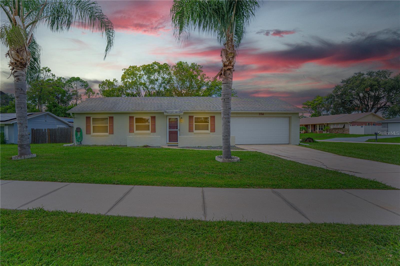 Cute + Versatile! This 2 bed, 2 bath corner-lot home checks all the boxes: fully fenced yard, inside laundry, easy-care flooring, and a spacious air-conditioned sunroom that can be whatever you need: office, playroom, extra living space, or even a 3rd bedroom. The primary suite offers a walk-in closet and ensuite bath, while the open-concept floorplan makes everyday living and entertaining a breeze. You’ll love the large corner lot: plenty of room for pets, play, and outdoor fun with your patio set or firepit. Whether you’re a first-time buyer, downsizing, investing, or searching for a Florida getaway, this home is full of possibilities. Schedule your showing today and see this cutie for yourself!