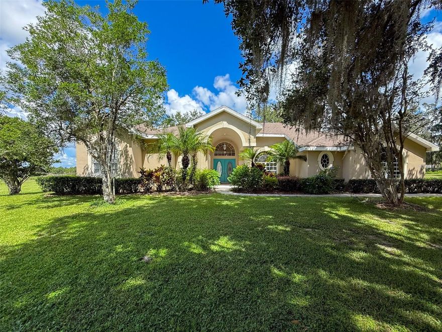 I need a farmer, a rancher, a landscaper or a family wanting room to Roam. I feature a three bedroom, two bath, 30 ‘x 21’ garage pool home, a small barn/workshop with electric, and a guest house, office or even an in-law suite! I know the guest house needs finishing on the inside and touch up on the outside, but the main house is beautiful. I was home to a former landscape farm and a hops growing farm. My 9.5 acres is cleared. I was originally built in 1998 by Palmwood builders, but was completely remodeled in 2008. My large kitchen area with tile floors, 42 inch wood cabinets, granite countertops, and upgraded appliances leaves you wanting for nothing. Plenty of room for everyone to sit at the kitchen breakfast bar or enjoy overlooking the pool from the breakfast nook. You will love entertaining in the formal dining room or overlooking the pool from the living room. Casual times will find you in my family room, which includes a built-in stereo sound system by Vienna, and a lovely view of the pool. I have an office/den or 4th bedroom too!  Did I mention my pool…. it’s deep, it’s 30 feet x 15 feet… and it’s fully screen enclosed. I am certain you would love my oversized master bedroom and en-suite bathroom featuring a soaking tub, fully tiled shower with spa showerheads & double sink vanity. My owners are even going to install a new roof prior to closing! I could go on and on about my irrigation system, the 10’ x 15’ frame barn/workshop with Electric and water, a large tank propane system, and the two bedroom, one bath 630 sq.ft. guest house. The guest house does need interior finishing but has water, electric and its own septic tank. I’m telling you I’m a class act, you cannot fully appreciate all I have to offer without a visit. Once you turn off Powell Road, you will fall in love with my newly paved lane... country living at its best. Did I mention easy access to Tampa, Wesley Chapel, etc.? You could be my next loving family, I know you’ll fall in love if you’ll just come see me. I’m waiting for your visit, call and make an appointment today.