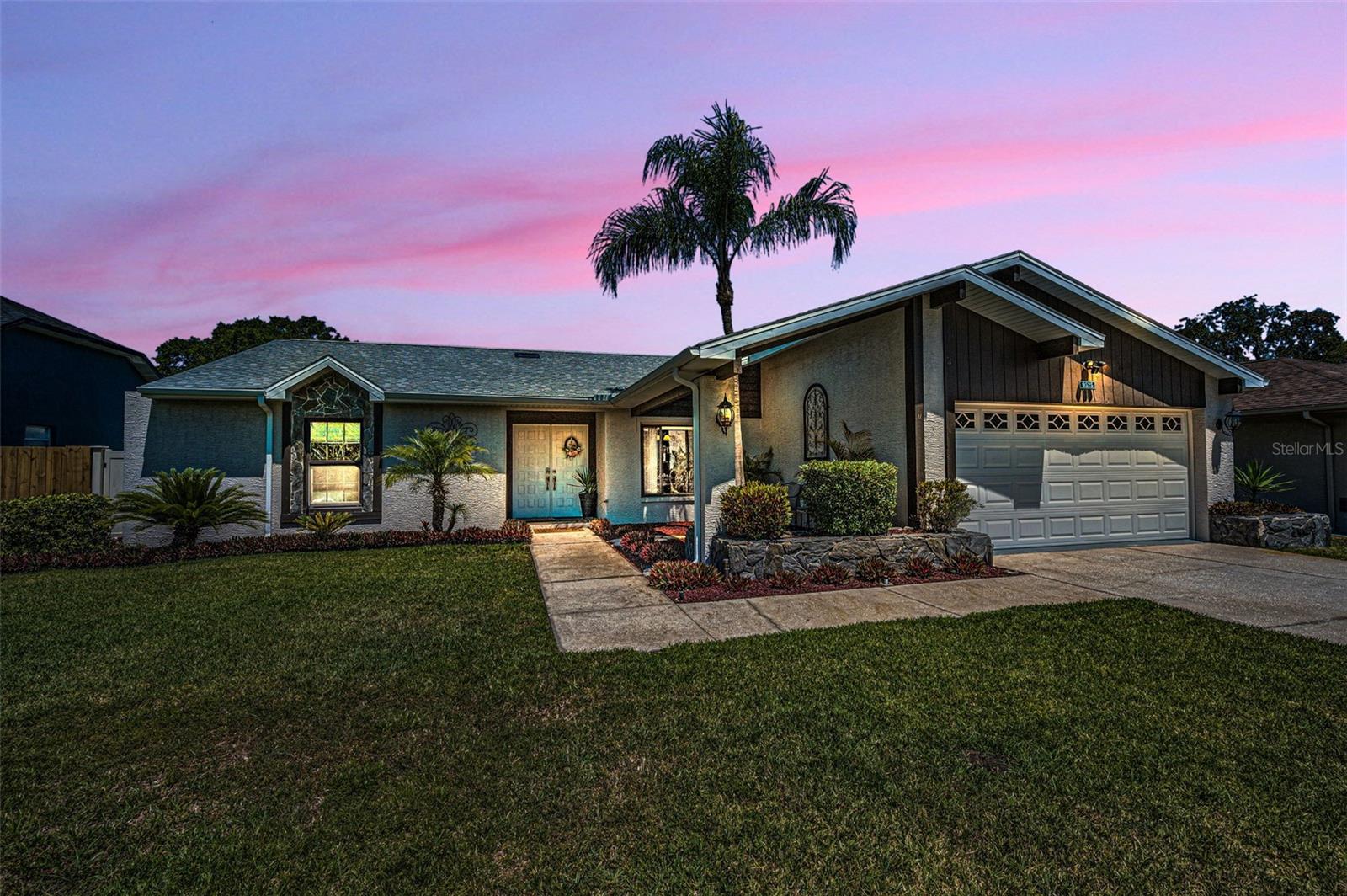 Located in the desirable Hunters Ridge community with low HOA fees, this beautifully maintained 3-bedroom, 2-bath pool home offers the perfect blend of comfort, charm, and outdoor living. From the moment you arrive, the double-door entry invites you into a bright and open floor plan featuring cathedral ceiling, skylights, and a cozy wood-burning fireplace—ideal for gathering with friends and family. With over 2,000 sq ft of heated living space, there’s plenty of room to live, relax, and entertain. The wood floors in the dining room add warmth and elegance, while the spacious layout flows effortlessly into the heart of the home. One of the standout features is a versatile bonus room (15x11) connected to one of the bedrooms, which opens directly to the expansive pool deck. Step outside and enjoy the true Florida lifestyle with a screened-in pool, outdoor shower, designated grilling area, and a covered private patio space in the fully fenced backyard. Major updates give peace of mind, including a new roof (2022), AC (2016), and hot water heater (2022). You’ll also appreciate the whole-house water purification system, modern windows, irrigation system, and Ring security system included with the home. The garage offers pull-down attic access for extra storage, and the home has been freshly painted inside and out in recent years. As a bonus the outdoor TV, dry bar cabinet and outdoor refrigerator all convey—everything you need to enjoy Florida living from day one! Home is conveniently located near shopping, top golf courses, beautiful beaches, and parks. This home checks all the boxes for location, comfort, and lifestyle.