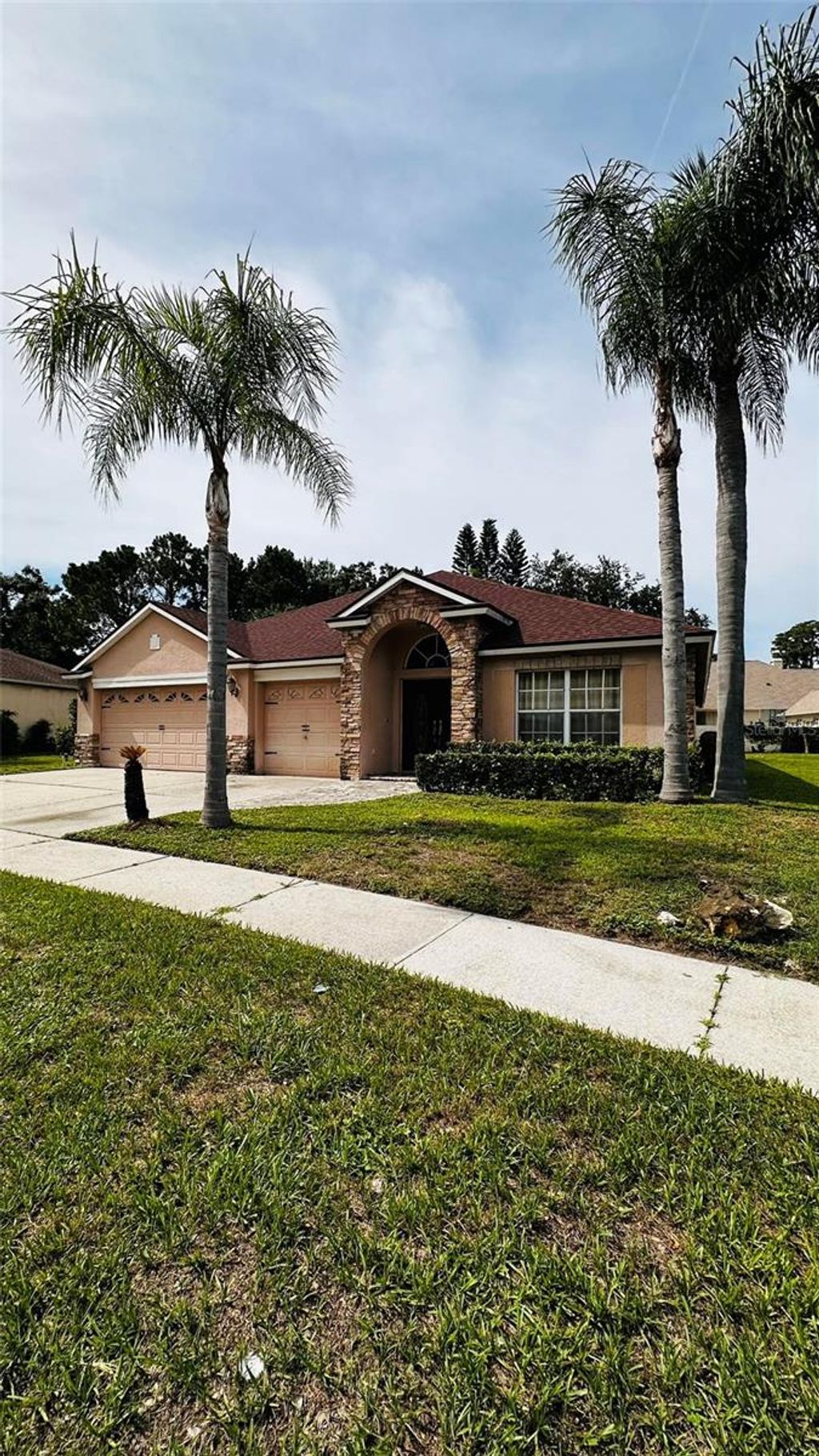 Photo of 1412 Wyndham Lakes Drive, Odessa, FL 33556 (MLS # TB8409618)
