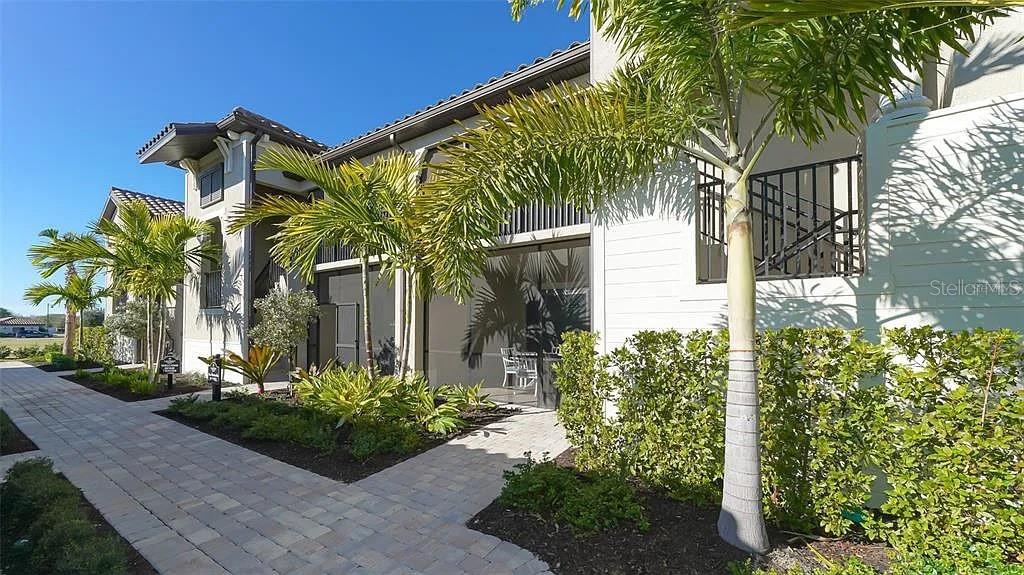 GOLFER'S DREAM!! This exceptional condo is just yards away from all the world-class amenities that Lakewood National has to offer. The community boasts two top ranked 18-hole Arnold Palmer designed championship golf courses, Commander and Piper. Located on Piper Course 1st hole, one of your favorite spots will be your back lanai where you can sip your morning coffee while watching the golfers tee off and then watch spectacular sunsets in the evenings. Get your clubs - outside your door is the chipping range, with the putting green and driving range just beyond. Start your day with a session at the driving range, a workout at the state-of-the-art gym, or an invigorating spin class. Afterward, unwind at the full-service spa, sauna, or steam shower, or take a relaxing soak in the hot tub. When it’s time to refuel, enjoy a casual lunch or dinner at the Tiki bar, which overlooks the stunning zero entry resort-style pool with cascading waterfalls. For a more refined dining experience, the elegant clubhouse offers a beautiful modern atmosphere with a bar, dining rooms, and more. Beyond the incredible golf and dining options, Lakewood National boasts an array of recreational activities. Take advantage of the tennis, pickleball, and bocce courts, or join in on the exciting events organized by the full-time activities director. There’s always something happening to keep you entertained in this vibrant, amenity-rich community!
