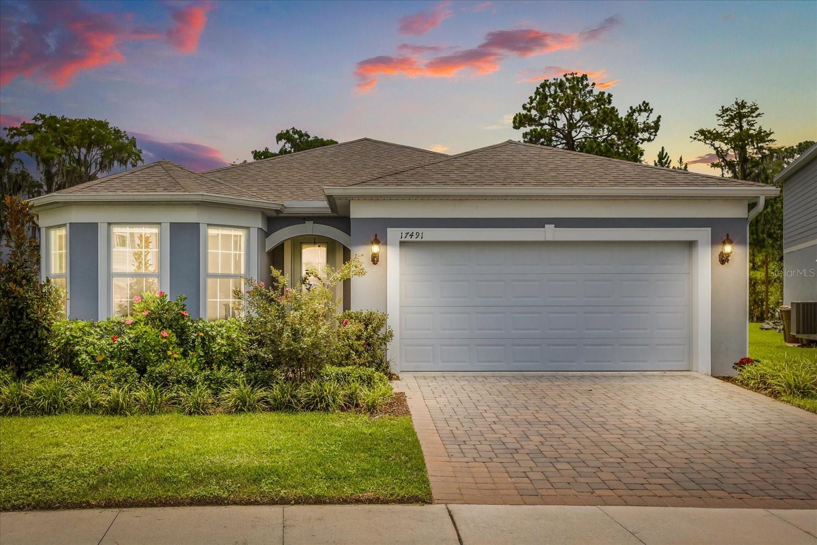 Tucked away in the tranquil, gated community of Serenoa Lakes, this stylish 3-bedroom, 2-bath + an office/flex-space retreat blends modern living with scenic natural beauty. Thoughtfully designed for comfort and connection, the open-concept layout centers around a gourmet kitchen with quartz countertops, stainless steel appliances, soft-close cabinetry, and an oversized island perfect for gathering. The spacious living and dining areas flow effortlessly out to a covered patio overlooking lush conservation views and a serene lake—no rear neighbors in sight.
Set on a premium lot with picturesque water views, this home is ideally situated next to the community dock—perfect for quiet sunsets or launching a kayak. Nearly $90,000 in builder upgrades enhance the home's appeal, including luxury finishes and future-focused features like a pre-wired electric vehicle charging setup in the 2-car garage.
The primary suite is a private escape featuring a luxurious en-suite bath with dual vanities, a walk-in shower, and an expansive closet. Additional highlights include a large laundry room with utility sink and ample storage throughout. Built in 2023 and move-in ready, this single-story home offers both style and function.
Life in Serenoa Lakes means more than just a beautiful home—it’s access to resort-style amenities like a zero-entry pool, splash pad, kayak launch to Hancock Lake, dog park, walking trails, and a 6,700 sq. ft. clubhouse with fitness center and event space. With easy access to Disney, Horizon West, Winter Garden, and major roadways, this home offers the perfect balance of serenity and convenience.