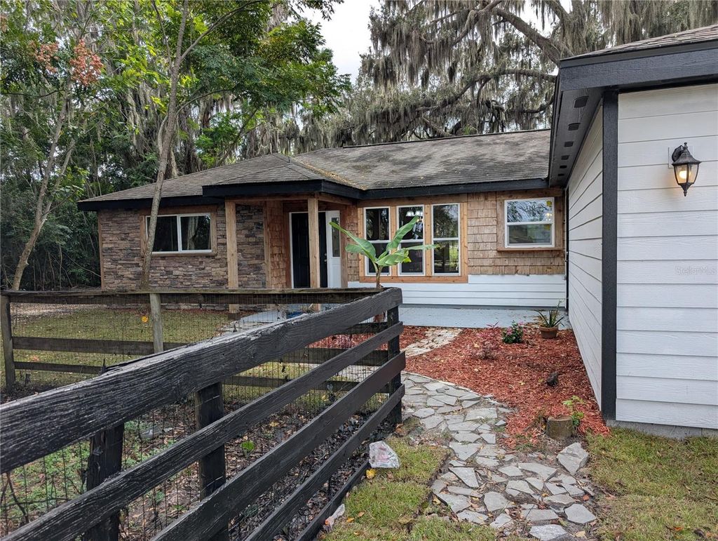 Photo of 12022 SE Sunset Harbor Road, Weirsdale, FL 32195 (MLS # R4910092)