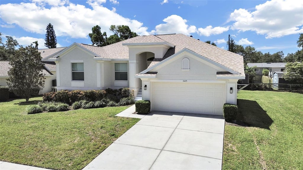 Photo of 1025 Lake Avoca Place, Tarpon Springs, FL 34689 (MLS # TB8520447)