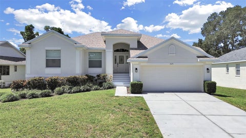 Photo of 1025 Lake Avoca Place, Tarpon Springs, FL 34689 (MLS # TB8520447)