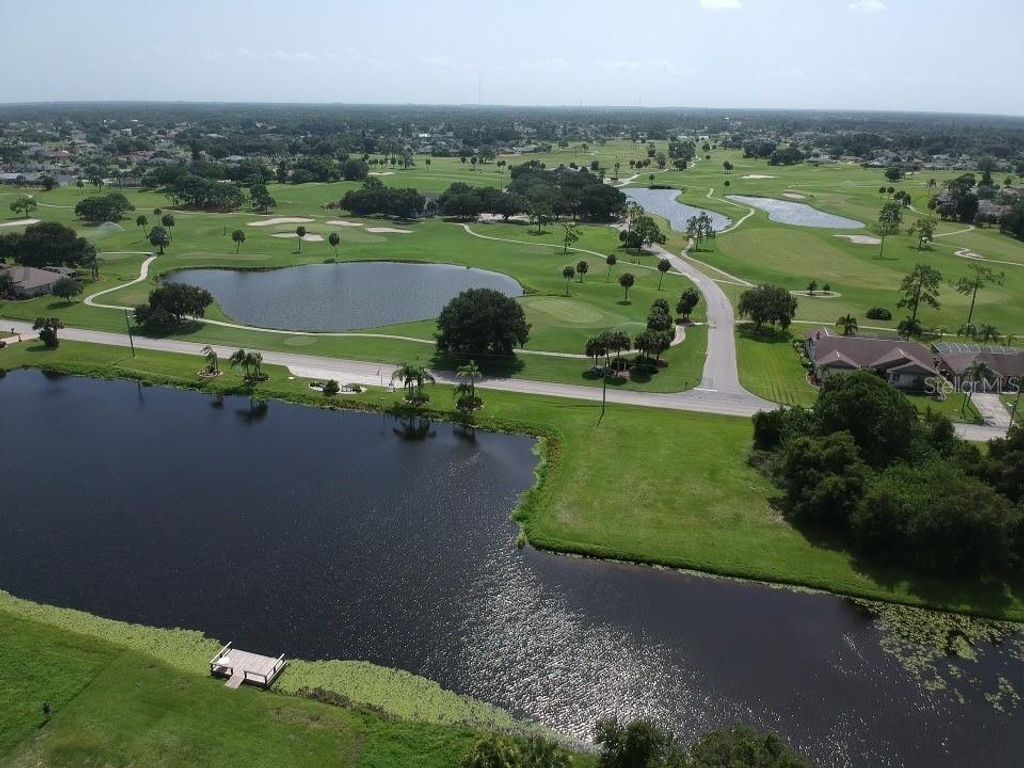 Photo of 278 Boundary Boulevard #B, Rotonda West, FL 33947 (MLS # O6350592)