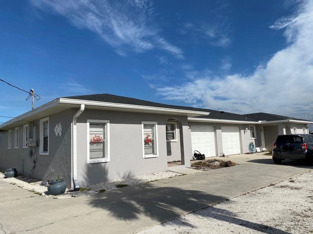 Photo of 278 Boundary Boulevard #B, Rotonda West, FL 33947 (MLS # O6350592)