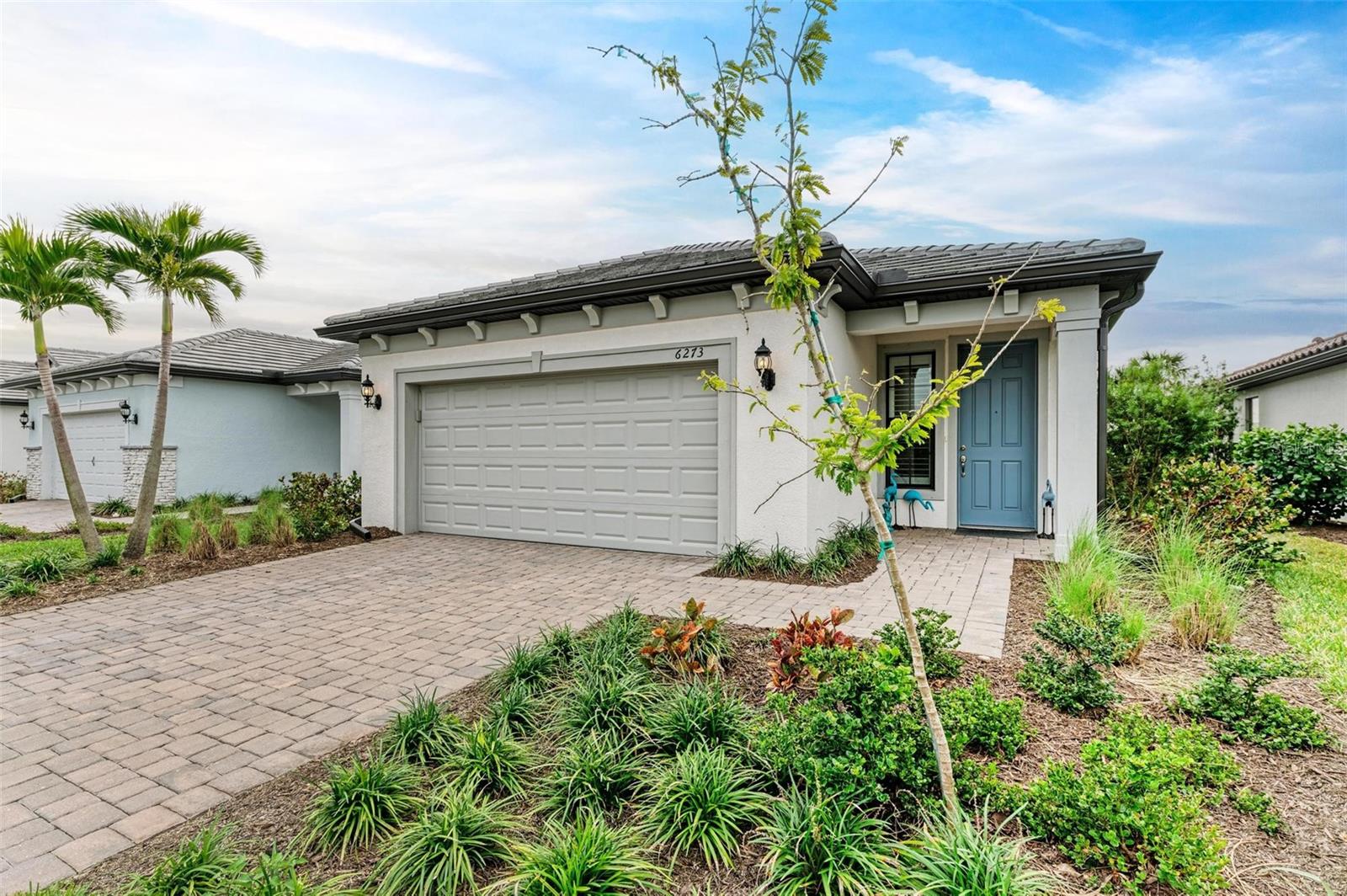 Enjoy living near the beach in the popular, recently built, beautifully designed and landscaped, gated, luxury resort-style community Talon Preserve on Palmer Ranch. Talon Preserve offers a clubhouse, serviced bar, heated pool, spa, full size gym, game arcade, ballroom, and pool-side restaurant. This is an excellent opportunity to own an attractively priced, almost new, fully upgraded, and very popular Hallmark floor plan with an extended, caged lanai and an outdoor kitchen. This 2BR + Den home sits on a spacious and private $43,000 premium homesite that offers a bright southern rear exposure, privacy, and the limited traffic that goes with living on a cul-de-sac street. The home's modern design includes large tile throughout the living area and flex room, 42-inch white shaker-style cabinets, Quartz countertops, and designer backsplash. The sizable primary suite offers 2 walk-in closets with built-in shelving and drawers, dual sinks, and a shower with frameless enclosure. Spend your Florida evenings on the spacious extended patio surrounded with luscious greenery watered with its own (owner-designed) automatic irrigation system. Enjoy al fresco dining using the outdoor kitchen with a natural gas grill and a refrigerator to prepare delicious meals. Additional Talon Preserve community amenities include 8 pickle ball courts, 2 tennis courts, and private community access to the Legacy Trail for biking, walking, and running enthusiasts. Talon Preserve is located near beautiful Suncoast Beaches (10 minutes away), gourmet restaurants, shops, historic downtown Venice, artsy downtown Sarasota, and just a short distance to the recently opened Sarasota Memorial Hospital Venice campus. Call today for your private showing!
