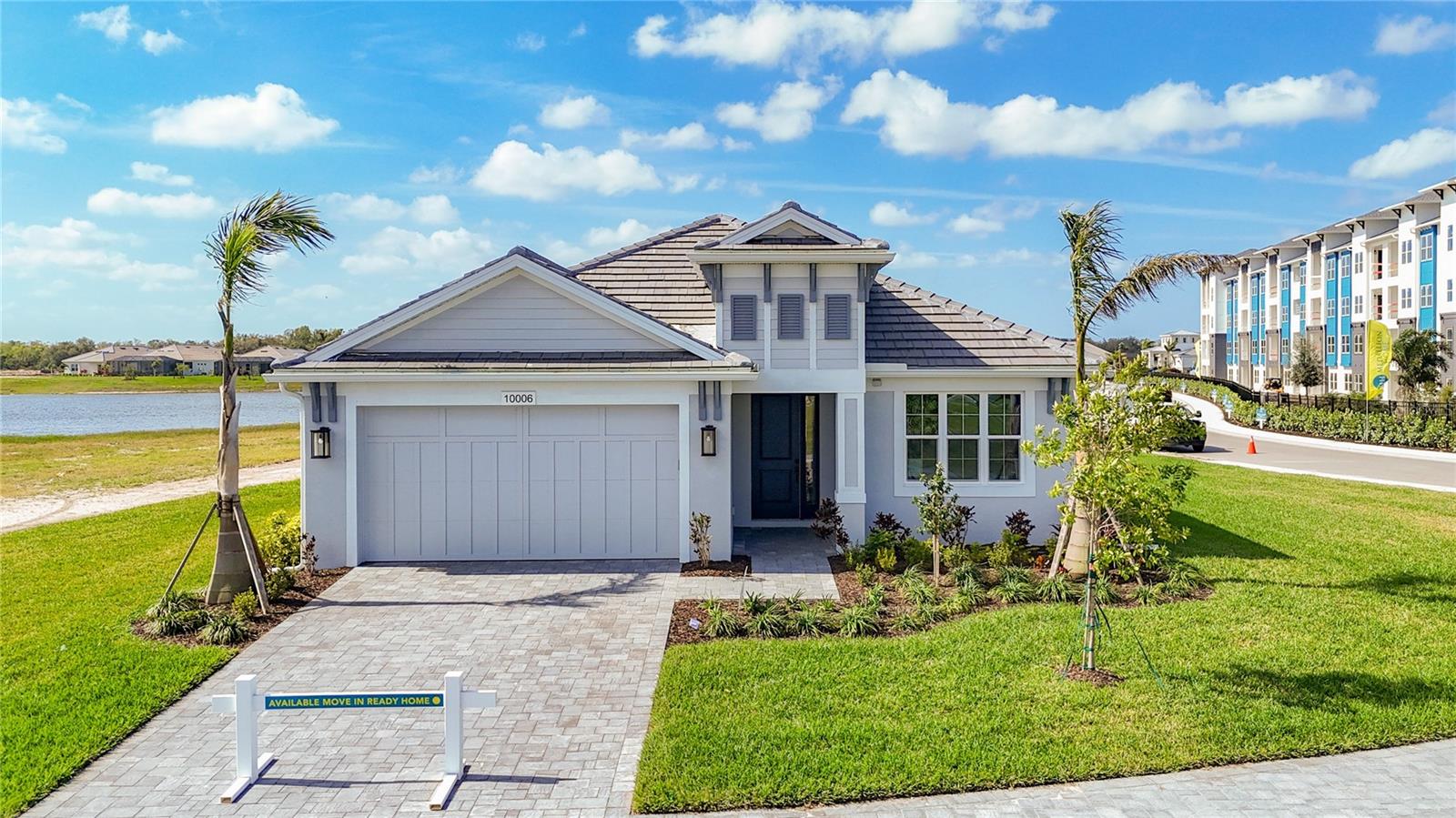 One or more photo(s) has been virtually staged. Welcome to the St Thomas; Medallion’s #1 selling open floor plan in Watercolor Place! This brand new, move in ready home on an oversized corner homesite features a paver driveway and tile roof. PLUS your very own private pool is now under construction and will be completed in time for summer! The St Thomas has won many Parade of Homes awards for it's open design, vaulted ceiling, and the extremely spacious primary bedroom and walk-in closet. There are 2 guest bedrooms with a shared bath, plus an extended den just off the foyer in the front of the home. You are sure to enjoy entertaining your guests in your well-appointed kitchen featuring a slide-in gas range, stainless-steel microwave, French door refrigerator, quartz countertops, and island that overlooks the dining area and great room. The soothing color scheme includes luxury vinyl plank flooring throughout your new home (no carpet), upgraded soft close cabinetry in the kitchen, baths, and laundry room, and faucets/fixtures are made by Moen. Medallion Home builds with high quality PGT impact-resistant windows and sliding glass doors...NO hurricane shutters needed here!! In addition to giving you peace of mind during storms, impact windows will lower your electric bills, cut your homeowners insurance costs, and decrease any outside noise. Enjoy the brand new Amenity Center with resort-style community pool, outdoor kitchen with grill, sink and outdoor refrigerators, indoor kitchen with warming trays, TV and lounge area, card room, plus the gym and yoga room in a separate building. There's also a fire-pit overlooking one of the lakes that provides amazing sunset views! Conveniently located near Lakewood Ranch for easy access to all the shopping and dining opportunities there, plus very close to Costco, Hobby Lobby, and the many new restaurants opening in The Marketplace at Heritage Harbour. Watercolor Place is a gated community; the HOA fee includes Spectrum internet, HD cable TV, lawn irrigation, lawn and landscape maintenance, amenity center, pool and gym use, common area and lake maintenance, and there are NO CDD fees!