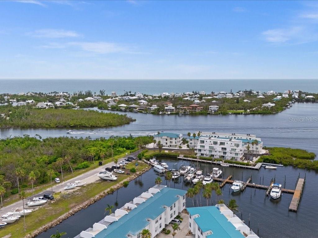 Once upon a time a builder and an architect, two brothers, decided to build homes on the ICW in the Cape Haze Marina. This is the architect’s home. Passed from one discerning owner to another, this is your chance to live the stylish dream. It's a rare find. Intentional design to maximize and fully experience the light, the breeze and the long views. Solid concrete on three levels with an elevator and outstanding waterfront views from all floors. Enter through an etched glass front door into a foyer that has an elevator or stairway to lead you up into the heart of the home. An oversized two car garage with a 12'x10' storage closet is on the bottom floor. Bedrooms are on the middle floor, and an outstanding entertaining level is on the top floor. But, there is more. Above the entertaining level is access to a 35'x18' roof-top observation deck with views of the ICW, the Islands and the Gulf! The views from all levels are extraordinary! Sunsets are beyond imagination. And, it’s close to everything important to those who live on the Cape Haze Peninsula and Boca Grande: outstanding beaches, great restaurants, preserved land, pristine waters, extraordinary fishing and fantastic marinas. Enjoy a thriving and vibrant social and arts scene! No HOA! Plus the area offers easy access to airports: TPA, PIE, SRQ, PGD and RSW! Seriously, what are you waiting for?