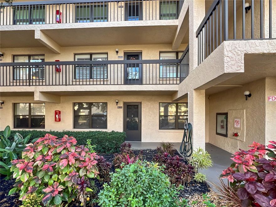 Welcome to easy Florida living in this first-floor, 2-bedroom, 2-bath condo within a desirable 55+ gated community. This DRIFTWOOD floor plan is the largest unit available at 1,100+ sq. ft., being offered turn-key furnished and move-in ready. Enjoy the convenience of first-floor access, a carport, and outside storage, all surrounded by lush tropical foliage just outside both the front and back entryways. The pool and clubhouse are only a short walk away, creating a true resort-style atmosphere. The community is also pet friendly. The kitchen features a center island with seating (not a galley kitchen), oak cabinetry, a brand-new wall microwave, and a new dishwasher—ideal for both everyday living and entertaining. Ceramic tile flooring runs throughout, complemented by stylish barn doors, with new ceiling fans and light fixtures in each room. Both bedrooms offer walk-in closets, and the primary suite includes a private full bath. A Florida room off the dining area provides flexibility for a home office, craft room, workshop, or additional storage. Adding valuable living space and can be enjoyed year-round as a sunroom. Additional highlights include a washer and dryer in the utility area and a one-year-old air conditioner with UV light, backed by 9 years remaining on a transferable parts and labor warranty. The HOA fee covers cable, WiFi, water, and pest control, offering peace of mind and simplified living. This well-maintained, spacious condo is an excellent opportunity for those seeking comfort, convenience, and an active lifestyle in the heart of Bradenton. Whether you're a full time or part time resident this condo suites many lifestyles. Come see for yourself today!