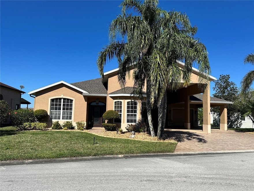 This home is one of a kind.  Located in the sought after community of Mt. Olive Shores North, a 55+ RV community in Polk County.  The home is on a beautiful lot with a pond for a great view every day.  With 3 large bedrooms and 2 1/2 bath there is plenty of space for guests.  The living room and kitchen are large enough to entertain with additional room at the back of the house for more seating.  The kitchen is a dream chef's space offering granite counter tops, commercial size range, double wall oven, warming drawer and two stackable dishwashers.  The primary bedroom has it's own sitting area and a very large primary bathroom including a jetted tub.  With a view to the pond from the sitting area, it's the perfect spot for that morning coffee to start your day.   There are two propane tanks on property for the Generac generator in case of power loss.
The RV port measures approximately 66x15 plus a garage for car and golf cart.
This home includes all of the furniture at time of showing as well as the gas powered golf cart.
There are so many features on this home, you need to see it in person.
Call today for an appointment.
