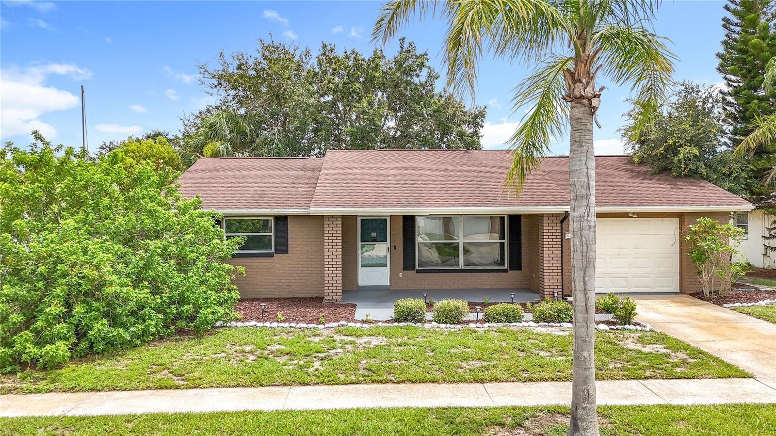 Welcome to your charming POOL home in Holiday, FL! This well maintained two-bedroom, two-bathroom, plus bonus room and one-car garage with Pool is a true gem and ready for a new owner. As you arrive at 5722 Mariposa Drive, you are greeted by great curb appeal and an inviting front porch. Once you step inside, you’ll find an open and spacious floor plan with flowing tile floors throughout that lead to views of your sparkling blue pool! The home boasts a master bedroom with an en-suite and walk in closet, while the 2nd bedroom is generous in size with a bath to the pool. The living room is large and opens into a bonus room that could easily serve as a third bedroom, office, playroom or other uses. The kitchen is a galley style and has space for a dinning table. Sliding glass doors open to your POOL with a large covered lanai, surrounded by screened enclosure - a perfect place for gatherings with friends and family! Your new home is ideally located too…tucked just between Tarpon Springs, Trinity and Downtown New Port Richey, you have easy access to a variety of local attractions and amenities including: Anclote River Park, just a short drive away, featuring a beautiful beach, boat ramps & picnic areas. Key Vista Nature Park, where you’ll enjoy scenic walking trails, observation towers, and stunning Gulf of Mexico views. The Tarpon Springs Sponge Docks, where you can experience a taste of Greece with authentic cuisine, unique shops, and boat tours. Fred Howard Park, known for its beautiful beaches and clear waters. Downtown New Port Richey with restaurants, homemade ice cream and festivals held year round at Simms Park on the River. Also near by are schools, shopping, and dining. This is a wonderful home in a ideal location, so don’t delay, come make 5722 Mariposa, your new home today!