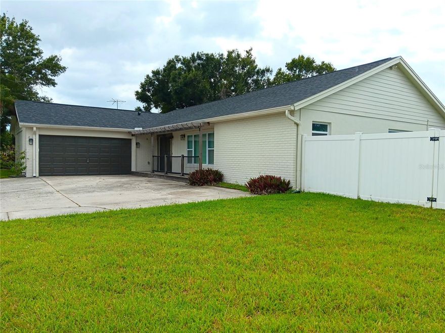 Wow! Stunning and recently renovated 4-bedroom, 3-bath home with in-ground pool and bonus accessory dwelling unit (ADU) on quiet circular street. Open floorplan features luxury stainless-appliance kitchen with large L-shaped granite-top island, eat-in area, with large windows and sliding doors overlooking the screened in patio and pool area. Expansive, L-shaped living-dining area is a flexible space for your recreation and entertainment needs. All LVP and ceramic tile flooring for easy maintenance. Two ensuite bedrooms on opposite sides of the house feature all new bathroom cabinets, fixtures and storage. One has a walk-in shower with multiple-showerheads for a relaxing water massage. The other has a large tub/shower with both overhead and hand-held showers. Two other spacious bedrooms share the third upgraded bathroom. Outside features a great air-conditioned ADU with access to a bathroom that could function as a guest room, hobby room, practice room for musicians, game room, library or quiet getaway place just because! Many additional closets throughout provide  great storage. Large birdcage-enclosed inground pool is just outside the back doors and is accessible from the kitchen and one of the bedrooms. Attached two-car garage completes the package. Lawn care and pool maintenance included in rent.