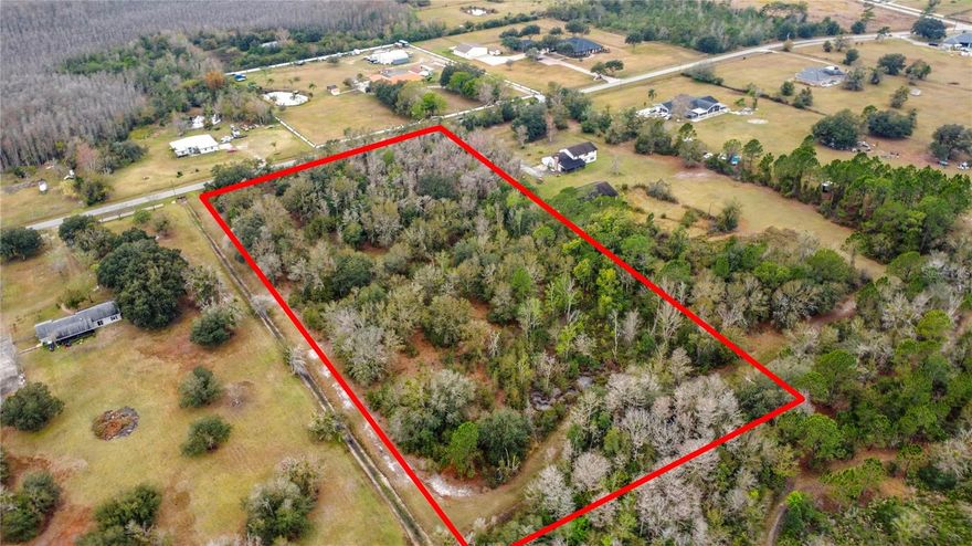 Discover a rare opportunity to own 5 acres of undeveloped land in the heart of Kissimmee — perfect for residential development, ranching, agricultural use, or your private estate. This parcel offers privacy with convenient access to city amenities, major roadways, and Central Florida attractions. Close to schools, hospitals and shopping.