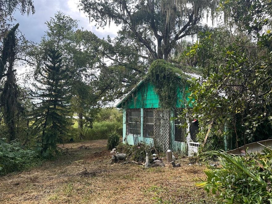 Check out this UNIQUE 38.97-acre WATERFRONT property conveniently situated between I-75 and the Suncoast Parkway! In addition to the 2/1 concrete block metal roof cottage (1,155 sq.ft.) nestled near the shoreline, this offering boasts a beautiful wooded secluded driving path to the home, an eclectic container box storage row with a covered breezeway which was previously used as a tool shed/workshop and as an arts and crafts studio. Part of the property is designated wetlands, part of the property is designated as timberland. Even though the cottage requires major renovation, other opportunities may exist in the forms of accessory structures as large as 2,500 sq.ft. or hunting or fishing camps or even an amazing vacation rental concept. Electric is not only connected to the home but other power poles are already in place for your future needs. Call today to schedule a personalized showing today!
