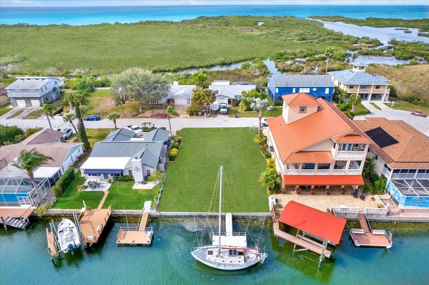 BOATER'S DREAM!  Build your dream house on this WATERFRONT lot with DIRECT ACCESS to GULF of AMERICA! One of the few remaining lots in SEA PINES SUBDIVISION, situated on a quiet CUL-DE-SAC. LOT, STREET and CANAL is closest to the GULF, and close to private, resident, restricted PARK.  This 6,000sq ft (60x100) buildable lot boasts a robust CONCRETE SEAWALL and a COMPOSITE FLOATING DOCK already in place and ready for your fishing and boating adventures. Underground utilities stand ready at the road front for a seamless connection. Prepare to be captivated by enchanting sunsets and the abundant wildlife that graces this exceptional location. Unleash your water adventures, whether it's fishing, kayaking, or paddleboarding, all right in your backyard. SEA PINES COMMUNITY, a waterfront haven with deed restrictions, generously offers residents a CLUBHOUSE, BOAT RAMP, and PARK FACILITIES. Explore the natural beauty of the Florida Nature Coast, celebrated for its conservation areas, wildlife sanctuaries, crystal-clear springs, and a picturesque coastline. Close proximity to shopping, nightlife, restaurants, healthcare, banks, churches, schools, marinas, golf, and more.  Located close to US HIGHWAY 19 for easy commuting to Tampa, Tarpon Springs, Clearwater Beach, Orlando, and surrounding areas.  Perfect location to enjoy living in the Florida lifestyle!