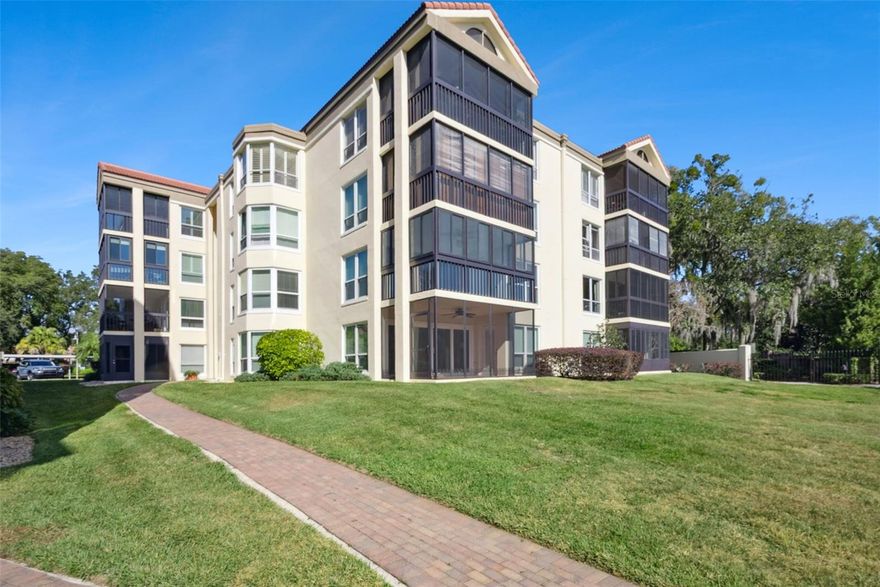 Enjoy lakefront living on the Winter Park chain of lakes in this top-floor penthouse condo. The Moorings on Lake Maitland, one of Central Florida’s most coveted waterfront communities. This spacious 2-bedroom, 2-bath residence offers soaring vaulted ceilings and beautiful lake views. Step inside to an abundance of natural light and a thoughtfully designed floor plan with no upstairs neighbors, ensuring maximum privacy and quiet. The large living area opens to a glass-enclosed sunroom with views of Lake Maitland—perfect for morning coffee or relaxing at sunset. The kitchen is bright and functional, featuring a breakfast nook and a walk-in pantry. The split-bedroom layout offers privacy and flexibility. The primary suite includes a generous walk-in shower,  plentiful closet space, and tranquil lake views. The guest bedroom and full second bath are perfect for visitors or a home office. The laundry is conveniently located tucked off the main hall, and with custom closets in both bedrooms, the amount of storage is great. For larger items, the unit includes a locking storage closet on the landing, and is perfect for bikes, golf clubs, holiday decorations, etc. The unit comes with one reserved covered parking space and plenty of guest parking. The complex has a newly renovated pool, hot tub, & clubhouse. Whether you're looking for a primary residence or a low-maintenance lakefront retreat, this rare top-floor condo offers an unbeatable combination of comfort, convenience, and waterfront access.