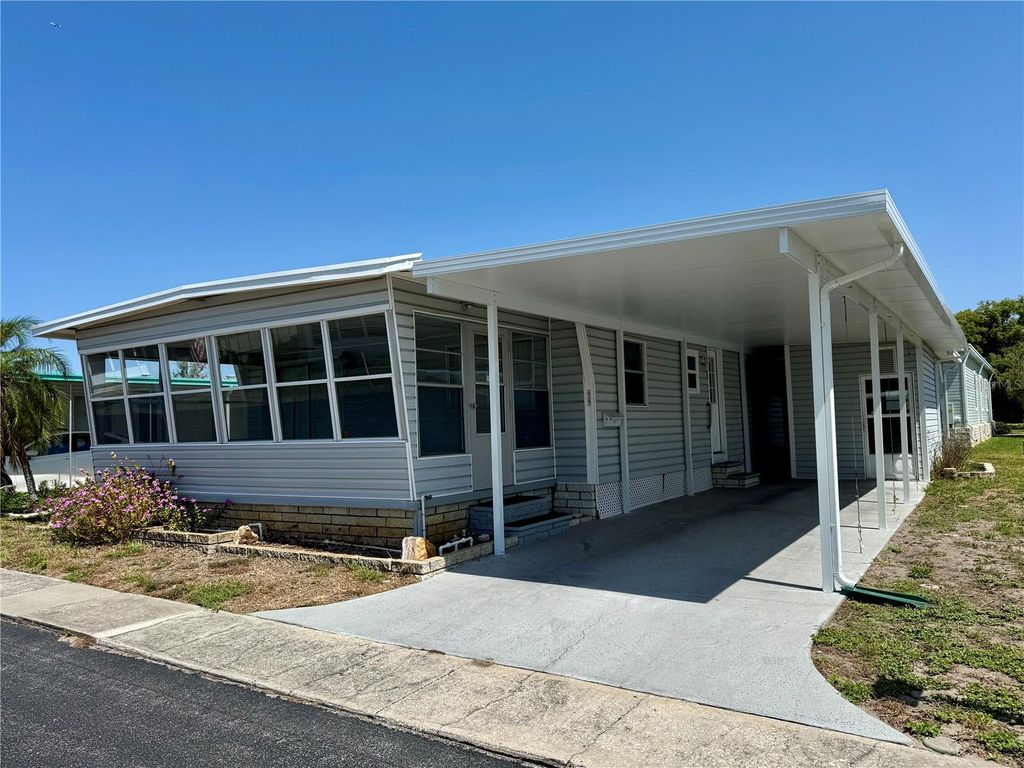 Photo of 99 Pindo Palm Street E, Largo, FL 33770 (MLS # TB8387342)