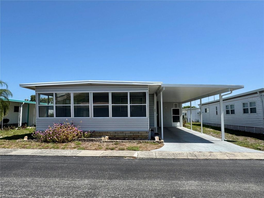 Photo of 99 Pindo Palm Street E, Largo, FL 33770 (MLS # TB8387342)