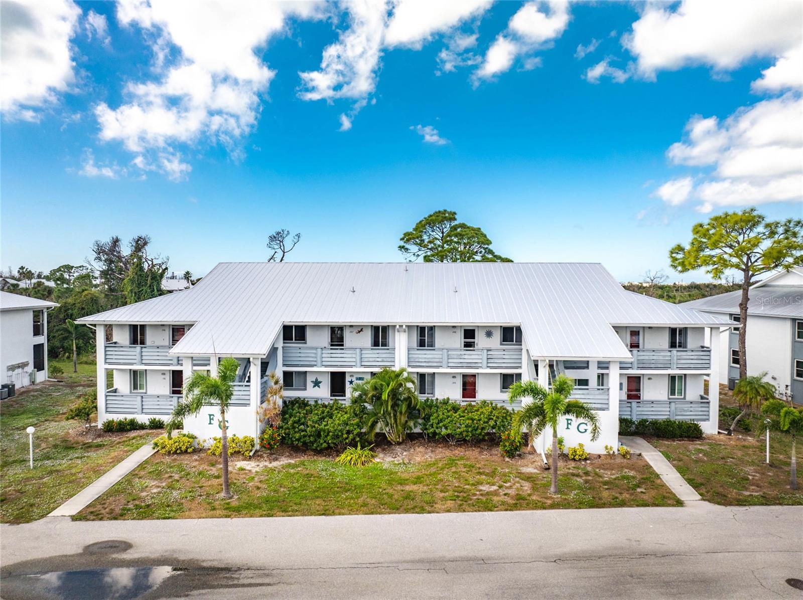 Exciting time to invest to own a condominium in beautiful South West Florida! This second - floor, middle unit gem, has proven its resilience through past storms- safely sheltered from wind shear on both sides and completely flood-free, thanks to its elevated position and a durable  metal roof! Step on to the balcony and enjoy sweeping tropical views, or relax inside  the stylish well - appointed home  offered "TURNKEY FURNISHED",  for your convenience. The  balcony flooring has been beautifully renovated with an attractive skid- free, poly-pebble finish. Live stress free, as you've found the perfect spot to unwind and take in the serene surroundings. Prices are now low, buy this rare, combination of style, safety, and comfort, ready for you to enjoy immediately! Resort style amenities include swimming pool, tennis courts, pickle ball courts, a fitness center, cable television, exterior maintenance.