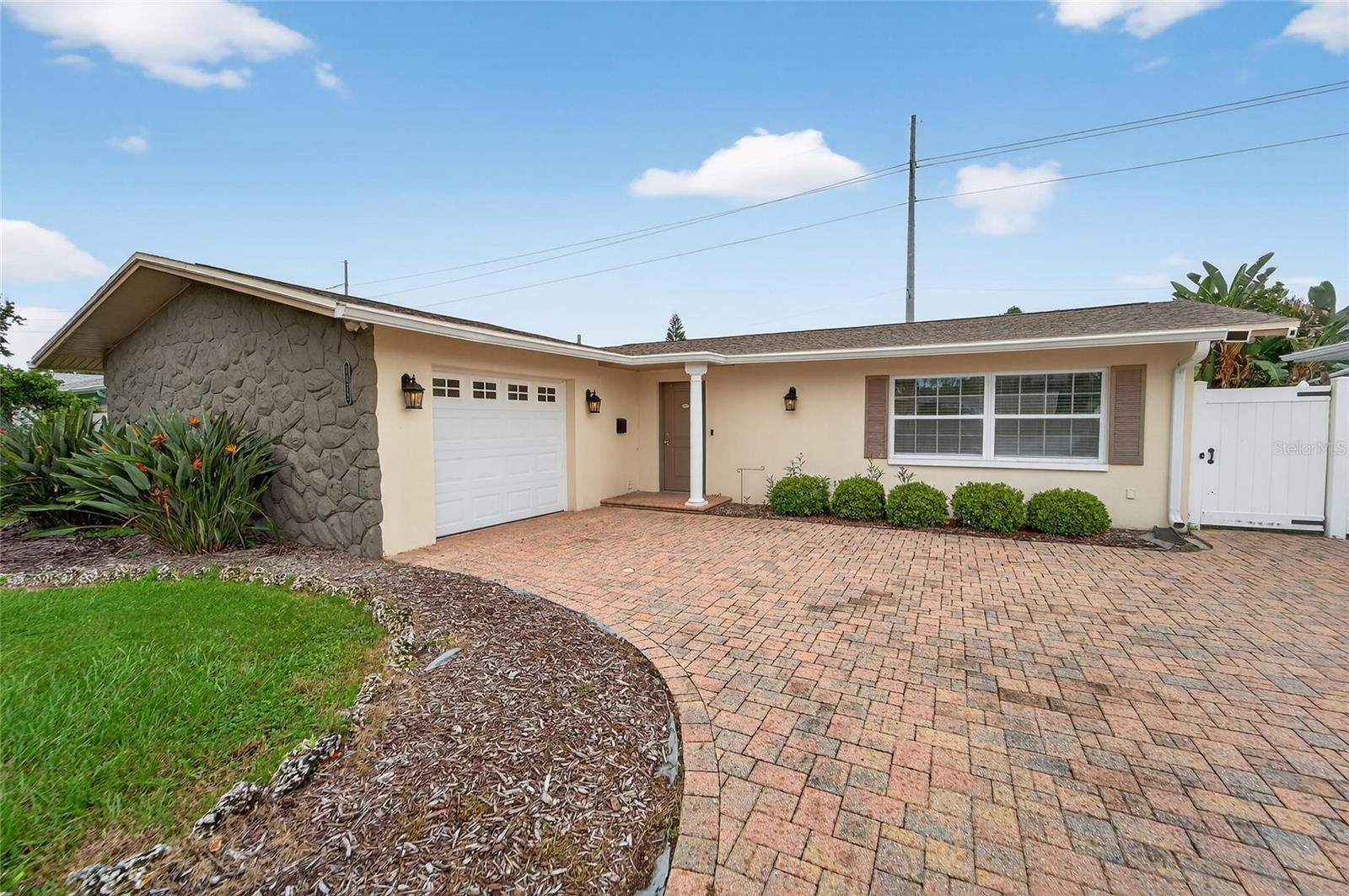 Welcome home to this beautifully renovated 2-bedroom, 2-bathroom home with a spacious two-car garage, located on a quiet street just 15 minutes from Clearwater Beach and minutes from charming Downtown Dunedin. Inside, you'll find a bright and open layout featuring a newly remodeled kitchen with a large island offering bar seating, stainless steel appliances, generous cabinet space, and a reverse osmosis water filtration system. The home also includes a water softener for added comfort!
Both bathrooms have been tastefully updated, and new luxury vinyl plank flooring runs throughout the home. Energy-efficient windows and sliding glass doors help reduce monthly utility costs while allowing natural light to flow in. The primary suite offers ample closet space with custom organizers, and ceiling fans are installed the the bedrooms for year-round comfort.
Step outside to enjoy a spacious screened-in lanai, perfect for relaxing or entertaining. The fully fenced backyard features lush sod and mature fruit trees, offering privacy and tranquility in a garden-like setting.
This move-in-ready home is a perfect combination of style, comfort, and location. $50 application fee per adult. $100 admin fee due after approval. Security deposit equal to 1 month's rent. Renter's insurance required. Utilities are paid by tenant. Lawn care is provided by owner. Call, text, or email to schedule your showing!