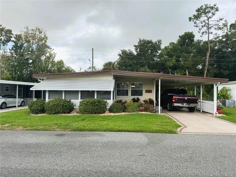 Photo of 131 Bougainvillea Drive, Leesburg, FL 34748 (MLS # R4910055)