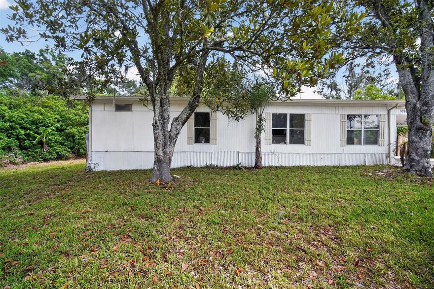 One or more photo(s) has been virtually staged. Welcome to 3302 Peachtree Hill Rd — a move-in ready home tucked away at the end of a quiet street, offering rare privacy and an oversized double lot totaling 0.26 acres. Backing up to 49 acres of vacant land, this property delivers a peaceful setting with no rear neighbors and exceptional outdoor space. Inside, you’ll find an open-concept kitchen featuring granite countertops, stainless steel appliances, and a functional layout ideal for both everyday living and entertaining. The home has been well maintained, including a newer AC system installed in 2023 for added peace of mind. Outdoor living is a standout feature with a large rear porch overlooking the spacious backyard — perfect for relaxing, grilling, or enjoying the natural surroundings. An oversized attached 2-car carport provides excellent covered parking and additional storage flexibility. Septic recently pumped. Conveniently located with easy access to shopping, dining, schools, and major commuter routes, this home combines privacy, functionality, and location. Enjoy nearby parks, recreation, and everyday conveniences while still benefiting from the quiet feel of an established neighborhood.