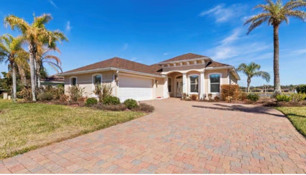 Photo of 154 Arena Lake Drive, Palm Coast, FL 32137 (MLS # FC316527)