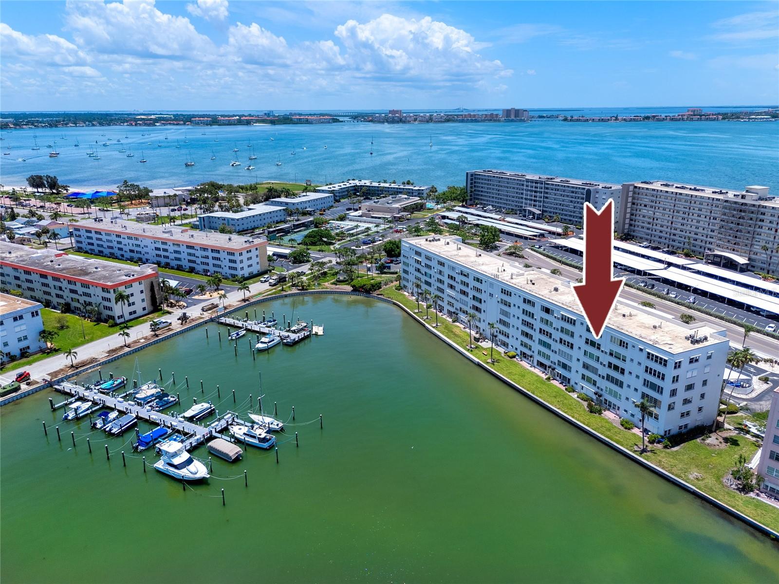 Welcome to the highly desirable Lancaster Building in Town Shores of Gulfport, a beautifully maintained, maintenance-free 55+ waterfront community located on the scenic shores of Boca Ciega Bay. Perfect for seasonal residents, snowbirds, or full-time coastal living, this fifth-floor 2-bedroom, 2-bathroom condo offers unmatched water views, turnkey updates, and the best of Florida’s resort-style lifestyle.
Step inside this fully remodeled unit, where every detail has been thoughtfully curated. The open-concept kitchen is a chef’s dream, featuring new cabinets, quartz countertops, glass tile backsplash, high-end stainless steel appliances, a Samsung refrigerator, and a 5-burner gas range—all while enjoying views of the bay. The kitchen flows seamlessly into the spacious living and dining areas, appointed with fresh paint throughout, new baseboards and crown molding, modern ceiling fans and lighting, and luxury vinyl plank flooring for a stylish, low-maintenance finish.
The standout feature is the extended Florida room, with a large additional storage closet and now enclosed with all-new windows providing a quiet, sun-filled space to relax while taking in the breathtaking water views. From here, enjoy front-row seats to dazzling sunsets, waterfront wildlife, and sparkling skyline views of Downtown St. Petersburg.
The primary suite offers private Florida room access via a new barn-style door, and a renovated en suite bath with an oversized walk-in shower. The second bedroom is equally spacious, featuring dual closets, with easy access to a modernized full hall bathroom.
This unit also includes a new HVAC and heating system (2022), new plumbing and updated electrical (fully rewired and hidden for a clean look), an Andersen storm-rated front door, and all-new windows and interior doors—ensuring modern comfort, efficiency, and peace of mind.
Residents of Town Shores of Gulfport enjoy a heated waterfront pool just steps from the building, plus access to four additional pools, two docks with water and electricity, and over 40 rentable boat slips (20’–40’), along with kayak launches—making this a dream location for boating enthusiasts. The community also features tennis and pickleball courts, shuffleboard, bocce, a fitness center, library, billiards room, clubhouse, and a second-story ballroom hosting regular social events.
Your monthly HOA fee covers hot water, gas, basic cable, and internet, adding to the convenience of this lock-and-leave property—perfect for those seeking part-time residence or a worry-free full-time lifestyle.
Just minutes away is the vibrant Gulfport Art District, home to award-winning restaurants, art galleries, boutiques, and the historic Gulfport Casino Ballroom. Golfers will appreciate the proximity to Pasadena Yacht & Country Club, and beach lovers are only a short drive from St. Pete Beach, Treasure Island, and Fort De Soto Park. Plus, with Tampa International Airport just 30 minutes away, travel is effortless.
Don’t miss this rare opportunity to own a fully remodeled, waterfront condo with sweeping views and boating access in one of Pinellas County’s most amenity-rich 55+ communities. Schedule your private showing today before it’s gone!