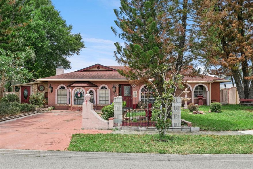 Tucked within a nice, quiet neighborhood just off John Young Parkway, this 4-bedroom, 2-bath home offers 2,136 square feet including a 524-square-foot air-conditioned enclosed garage with wood burning fireplace, providing flexible options for additional living, work, or hobby areas. An enclosed front sitting room creates a unique entrance into the home and adds to the versatile layout. The floorplan features an L-shaped great room perfect for living and formal dining, along with a spacious kitchen with a breakfast area. The bedroom layout offers privacy with all bedrooms tucked down a separate hallway, including a primary suite with its own bath. Additional features include a large utility room, an enclosed rear patio with walk-in storage, a sunroom, and more. With plenty of potential to update and personalize, this property is ideal for buyers looking to create their own vision. Centrally located near The Mall of Millenia, I-4, lots of shopping, and dining, with convenient access to Downtown Orlando, Walt Disney World and minutes away from Universal Studios Orlando.